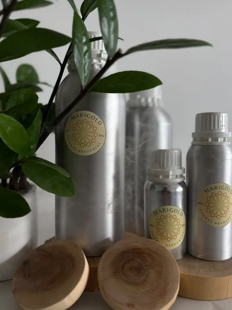 Labelled aluminium bottles of sandalwood oil